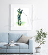 Framed watercolor painting of a golfer’s anatomy during a golf swing. The painting is hanging over a blue couch.