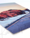 Angled view of a watercolor painting of a snowy Wisconsin landscape in the spring.