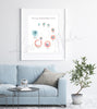  Framed watercolor painting of a follicle development cycle. The painting is hanging over a blue couch.