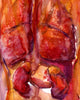 Unframed watercolor painting of the internal trunk organs in reds and oranges.