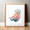 Framed watercolor painting of a fetus showing the spine and brain in rainbow colors.