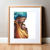 Framed watercolor painting of an african woman holding her premature infant. She is wearing a teal head wrap and is wearing her child in an orange wrap.