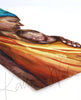 Framed watercolor painting of an african woman holding her premature infant. The print is at an angle.